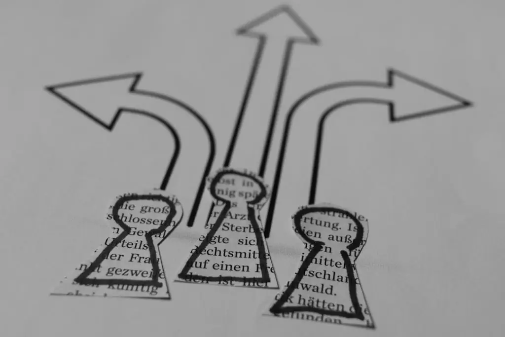 a-close-up-of-a-piece-of-paper-with-arrows-gypv7oh1g-a