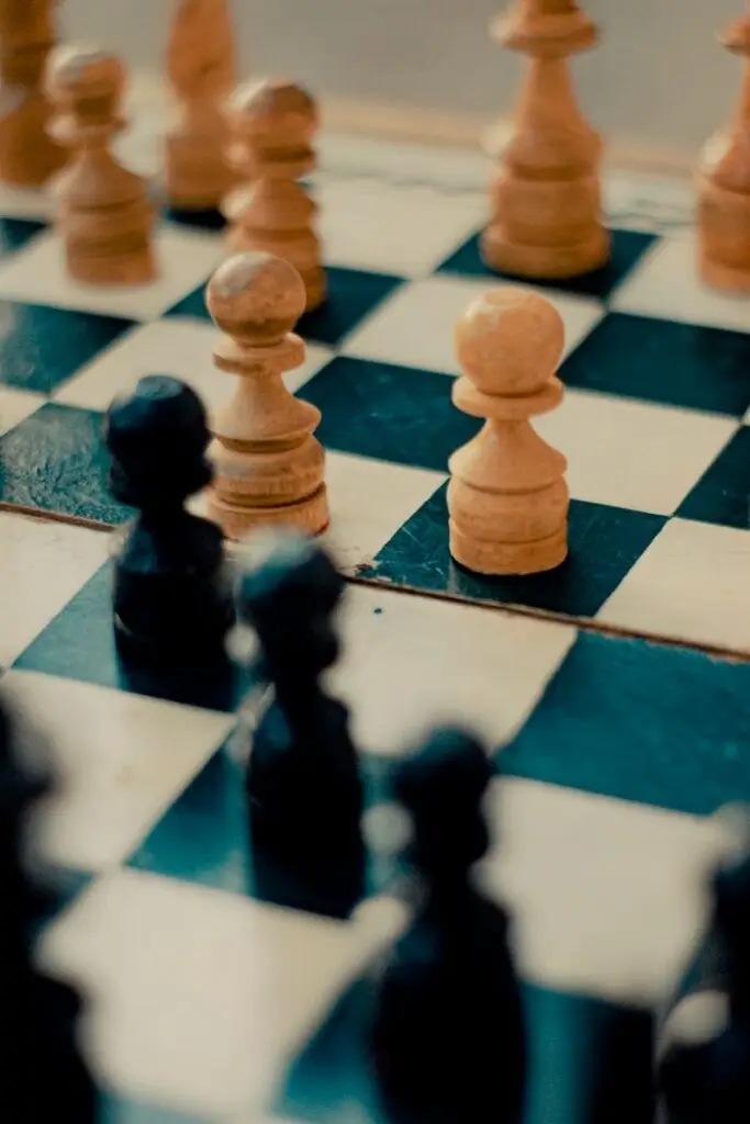 Close-up of a chess board highlighting strategic pawn placement for gameplay tactics.